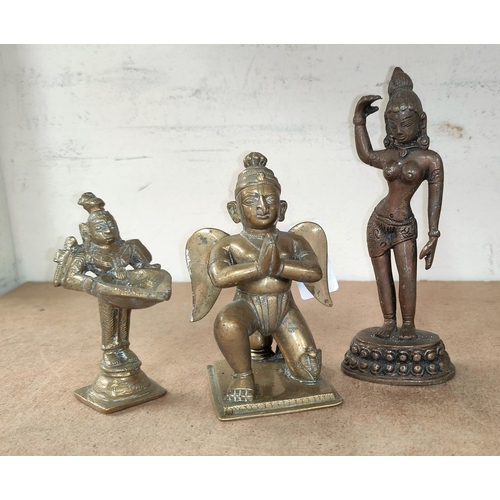 126 - An Indian brass pyramid deity height 12cm, and two similar figures.