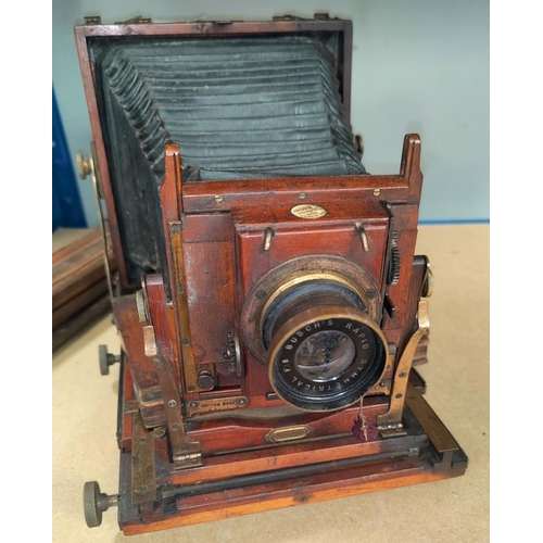 131 - A Thornton Pickard Victorian plate camera (time & inst.patent)together with the original wooden trip... 