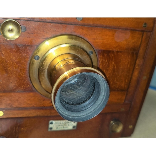 131b - A Dollond of London mahogany cased plate camera and plates.