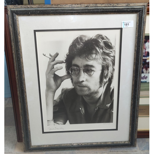 181 - A limited edition photo print of John Lennon smoking, signed Spud Murphy in pencil 497/750