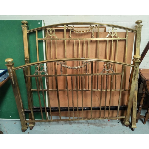 654 - A Victorian brass bed with railed ends and swag decorations