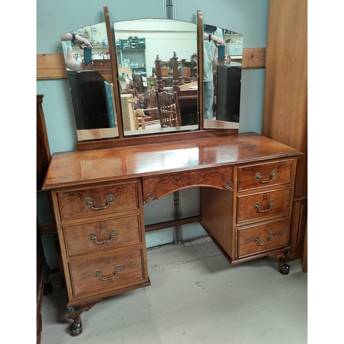 693 - A burr walnut bedroom suite in the Queen Anne style comprising part fitted wardrobe, kneehole dressi... 