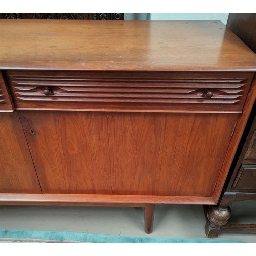 702 - A 1960's teak lowline sideboard by Dalescraft