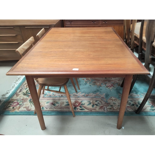 703 - A mid 20th century rectangular teak extending dining table with internal leaf by Dalescraft Fine Fur... 