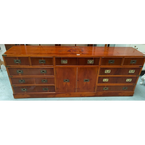 711 - A reproduction yew wood sideboard of 11 drawers and double cupboard