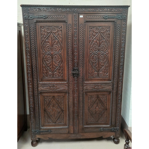 752 - An extensively carved Victorian oak double door wardrobe ht 212cm