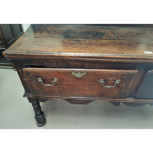 753 - A small 18th century oak dresser base with 2 frieze drawers, on turned legs width 146cm