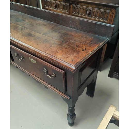 753 - A small 18th century oak dresser base with 2 frieze drawers, on turned legs width 146cm