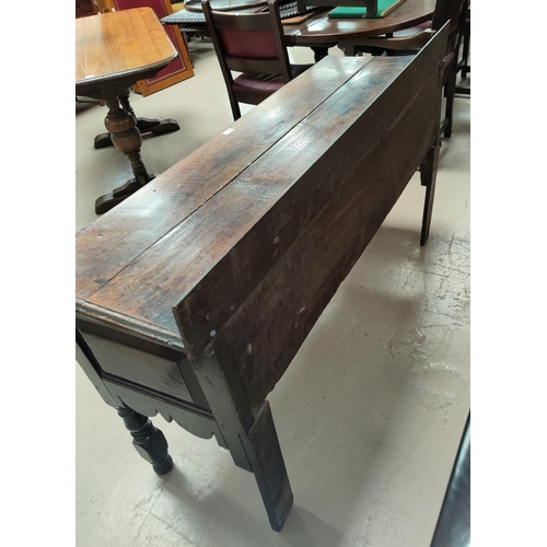 753 - A small 18th century oak dresser base with 2 frieze drawers, on turned legs width 146cm