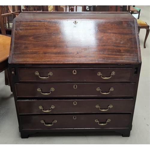 763 - A Georgian mahogany bureau with fitted interior four drawers bellow, with brass swan neck handles, w... 