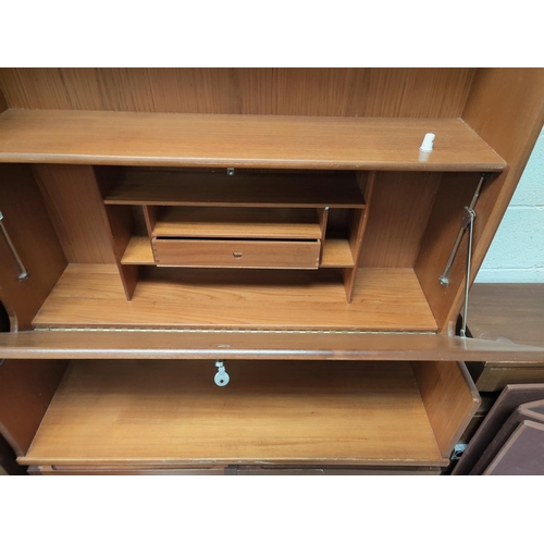 771 - A 1960's teak wall unit with fall front writing section