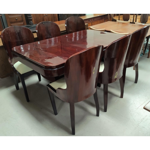 775 - An Art Deco dining suite comprising rounded rectangular table with ebonised mouldings on 'U' shaped ... 