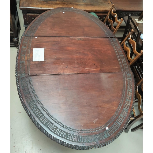 781 - An early to mid 1800's oval mahogany table top in 3 pieces with a very long hand carved saying to ou... 