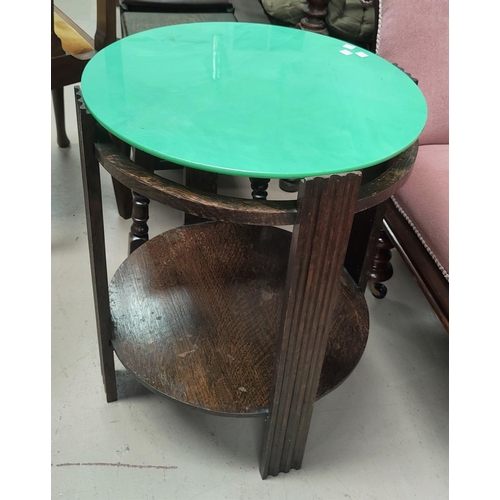 782 - A 1930's stained wood occasional table with green vitrolite glass top 51cm diameter