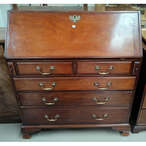 791 - A Georgian mahogany bureau with fall front, walnut fronted interior drawers, three long and two shor... 