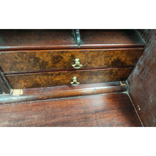 791 - A Georgian mahogany bureau with fall front, walnut fronted interior drawers, three long and two shor... 