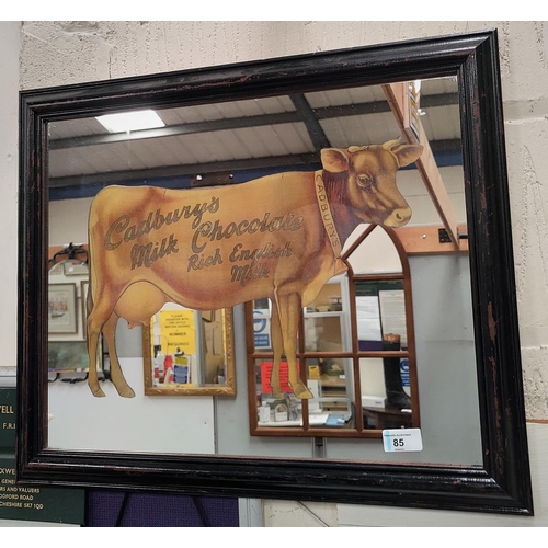 85 - An early 20th century style CADBURY'S shop advertising mirror depicting a cow and lettered 