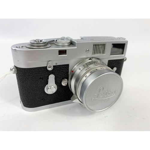 117 - A LEICA M2 chrome 35mm camera c.1960, serial no 966842, with 35mm f2 Summicron lens, leather E.R. ca... 