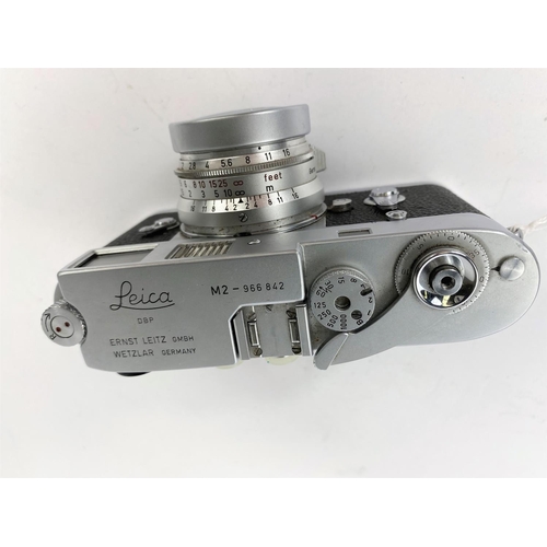 117 - A LEICA M2 chrome 35mm camera c.1960, serial no 966842, with 35mm f2 Summicron lens, leather E.R. ca... 