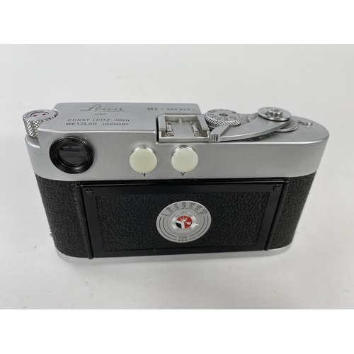 117 - A LEICA M2 chrome 35mm camera c.1960, serial no 966842, with 35mm f2 Summicron lens, leather E.R. ca... 