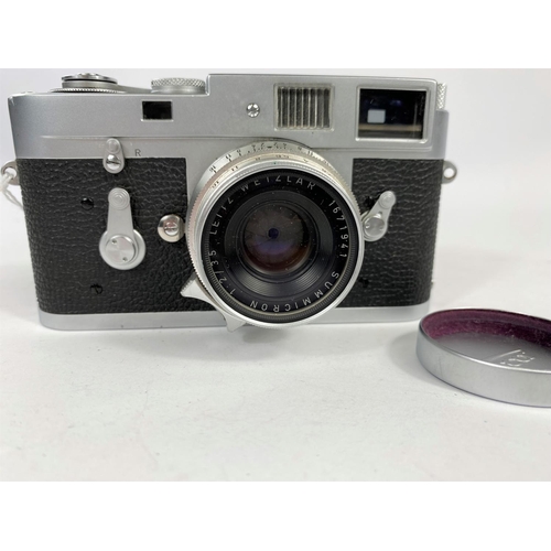 117 - A LEICA M2 chrome 35mm camera c.1960, serial no 966842, with 35mm f2 Summicron lens, leather E.R. ca... 