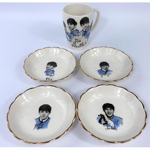 487 - Four Beatles dishes with the bands faces to each and a coffee cup with all four members