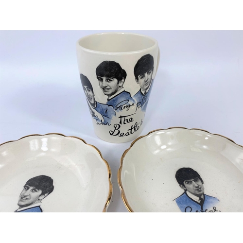 487 - Four Beatles dishes with the bands faces to each and a coffee cup with all four members