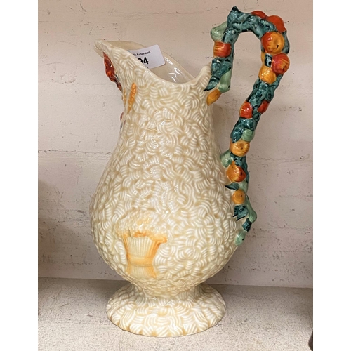 494 - A Clarice Cliff Harvest Pattern jug decorated with fruits and flowers etc ht 29cm