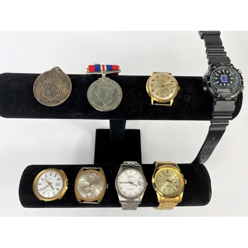 580 - A Gents Pulsar Wristwatch; other watches; a WW2 medal etc.