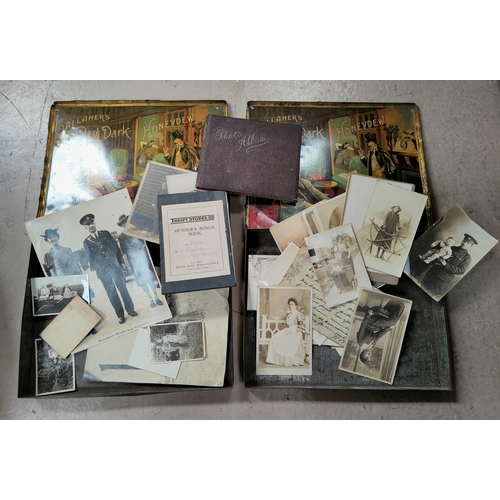 119 - A selection of early 20th century photographs, postcard, ephemera etc and two Callaher's vintage tin... 