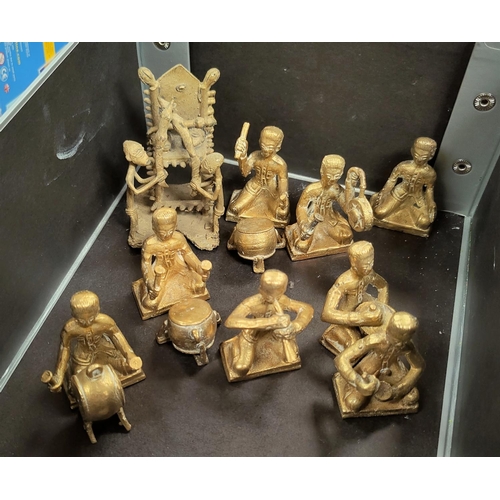 127 - A Middle Eastern brass band of drummers, 6cm; and a brass tribal style group, 9cm.