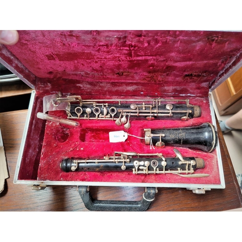 165 - A cased wooden Artia Clarinet stamped 1837, supported by Boosey &