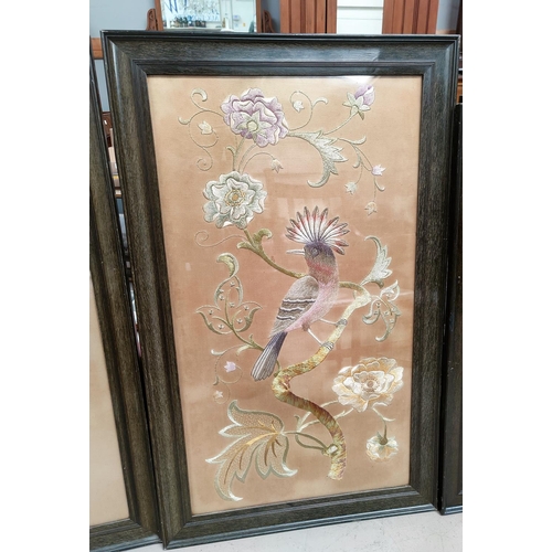 94 - Three early 20th Chinese large embroidered silk pictures, birds in trees, framed and glazed