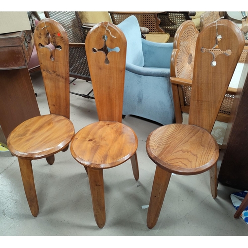 691 - A set of 4 handmade 'spinning' chairs with pierced backs, on triple legs