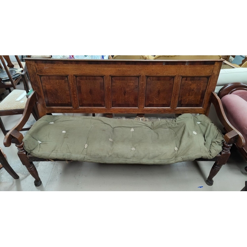 692 - An 18th century country made crossbanded oak settle with 5 panels to the back, on club legs