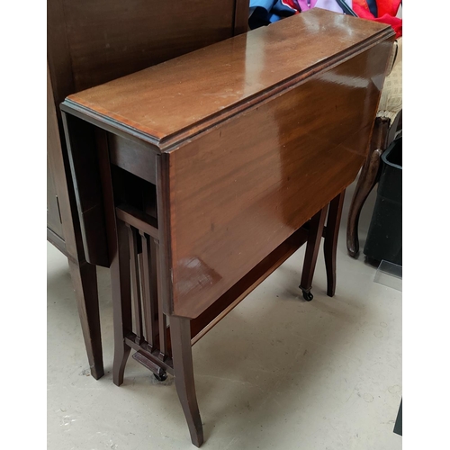 694 - An Edwardian crossbanded mahogany Sutherland table