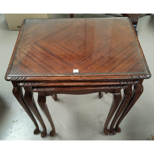 697 - A mahogany wine table with circular top and tripod base; a mahogany nest of 3 occasional tables