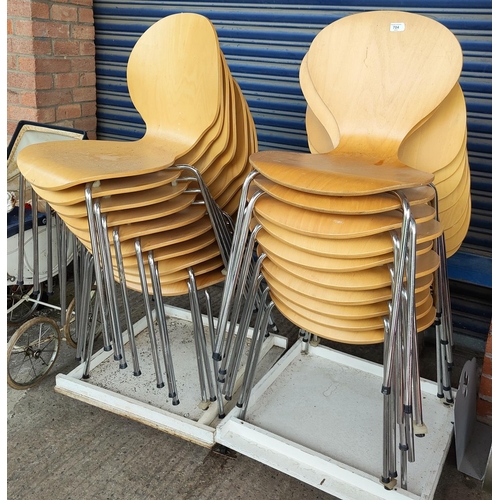704 - A modern set of 15 stacking chairs in chrome and moulded plywood, in the manner of Arne Jacobsen for... 