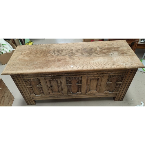 708 - A reproduction carved oak blanket box