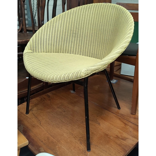 758 - A Lloyd Loom bucket/basket chair; a similar chair, a stool and a brass standard lamp.