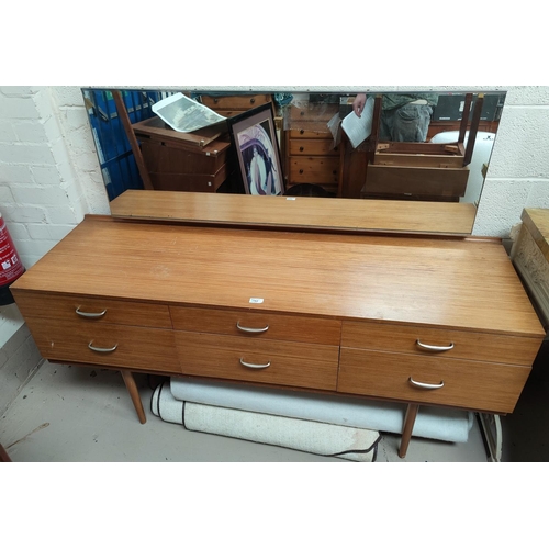 762 - A mid 20th century lightwood dressing table with 6 drawers, single long mirror, on tapering legs wit... 