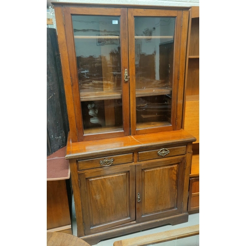 772 - An Edwardian walnut full height bookcase with 2 glazed doors over 2 cupboards and 2 drawers