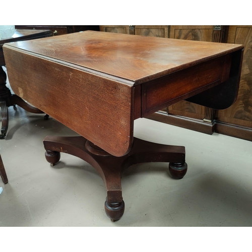 785 - A Victorian mahogany Pembroke table on a pedestal column with quatrefoil base.