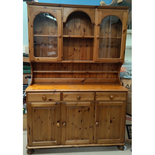 799 - A modern pine Victoria dresser with 3 cupboards and drawers below and cupboards above