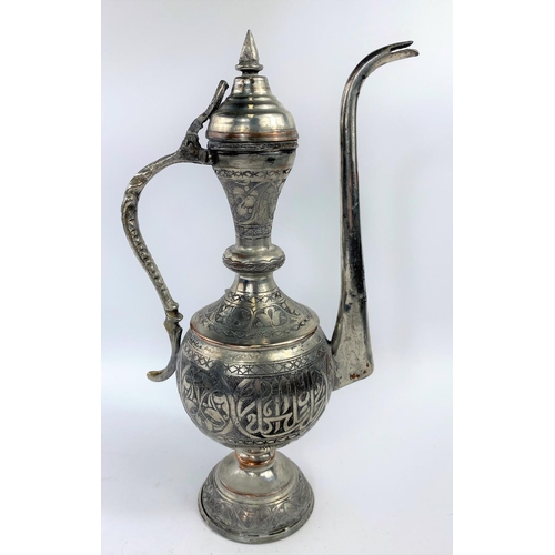 576 - A Middle Eastern silver on copper teapot ewer with animal decoration etc ht 34cm and a brass and cop... 