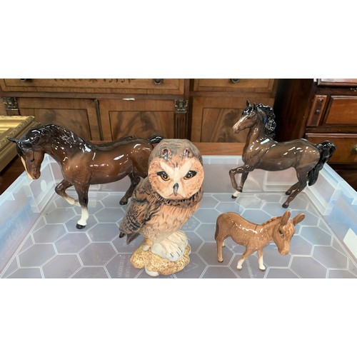 436 - A Beswick short eared owl; 2 Beswick horses; a donkey; etc.