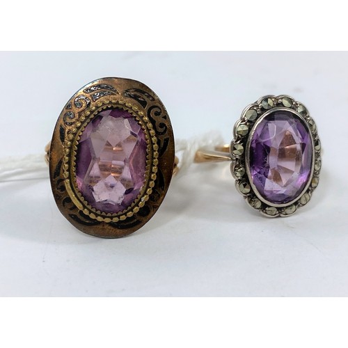 569 - A yellow metal ring stamped 9ct, set with an amethyst coloured stone surrounded by marcasite, 4gm; s... 