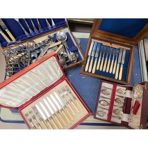 583 - A large silver plate toast rack; a red cased selection of fish servers, other boxed and loose cutler... 
