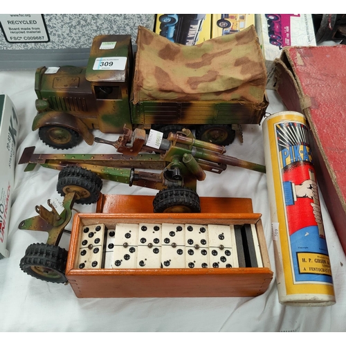 309 - A mid 20th century clockwork army camouflage wagon and field gun in tinplate; a set of dominos; a Pi... 