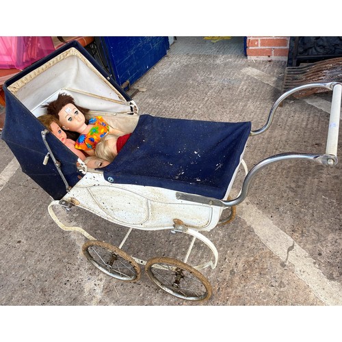 342B - A mid 20th century Child's Triang doll's pram and 4 1960's/70's dolls